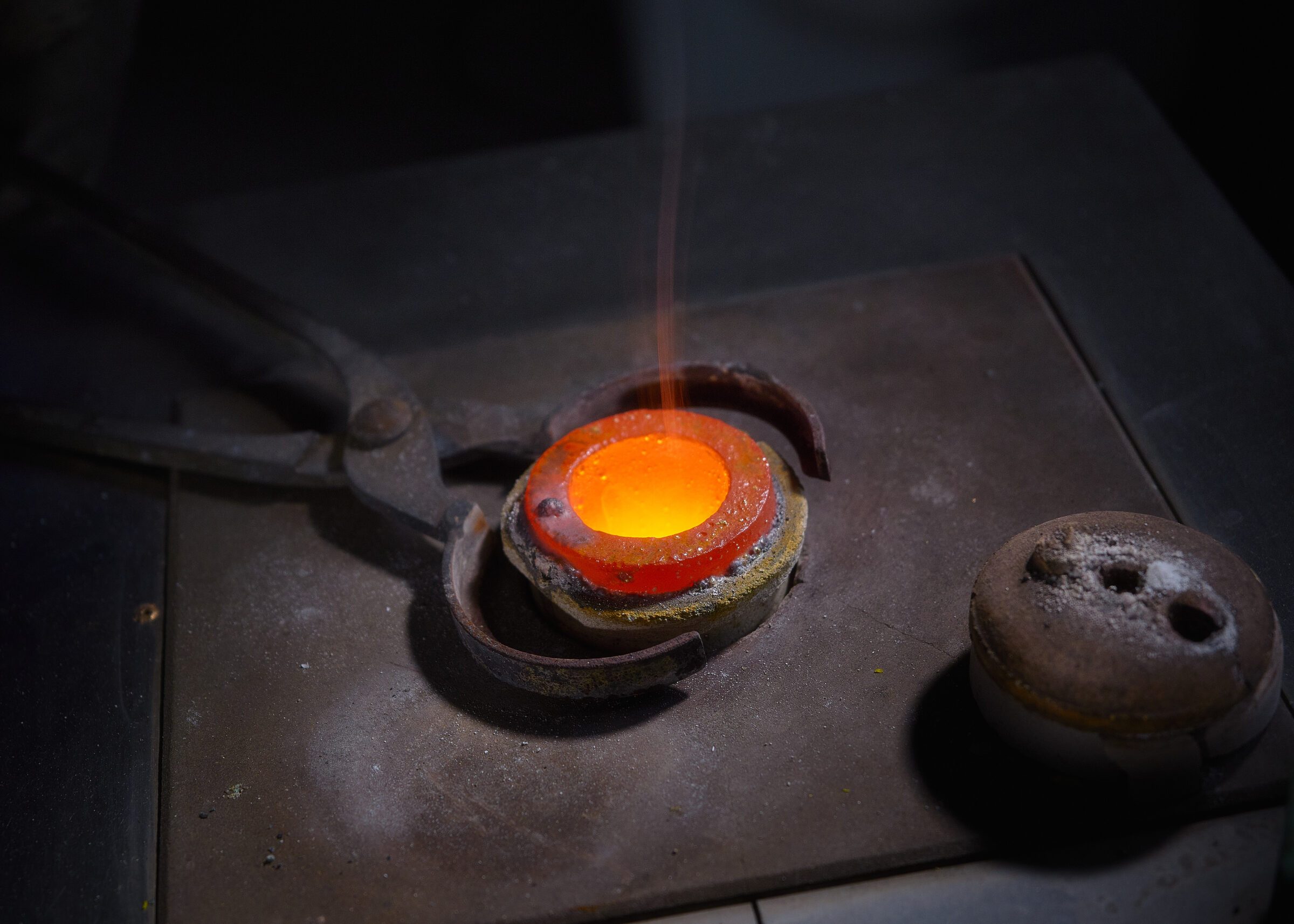 Molten metal glowing in the crucible