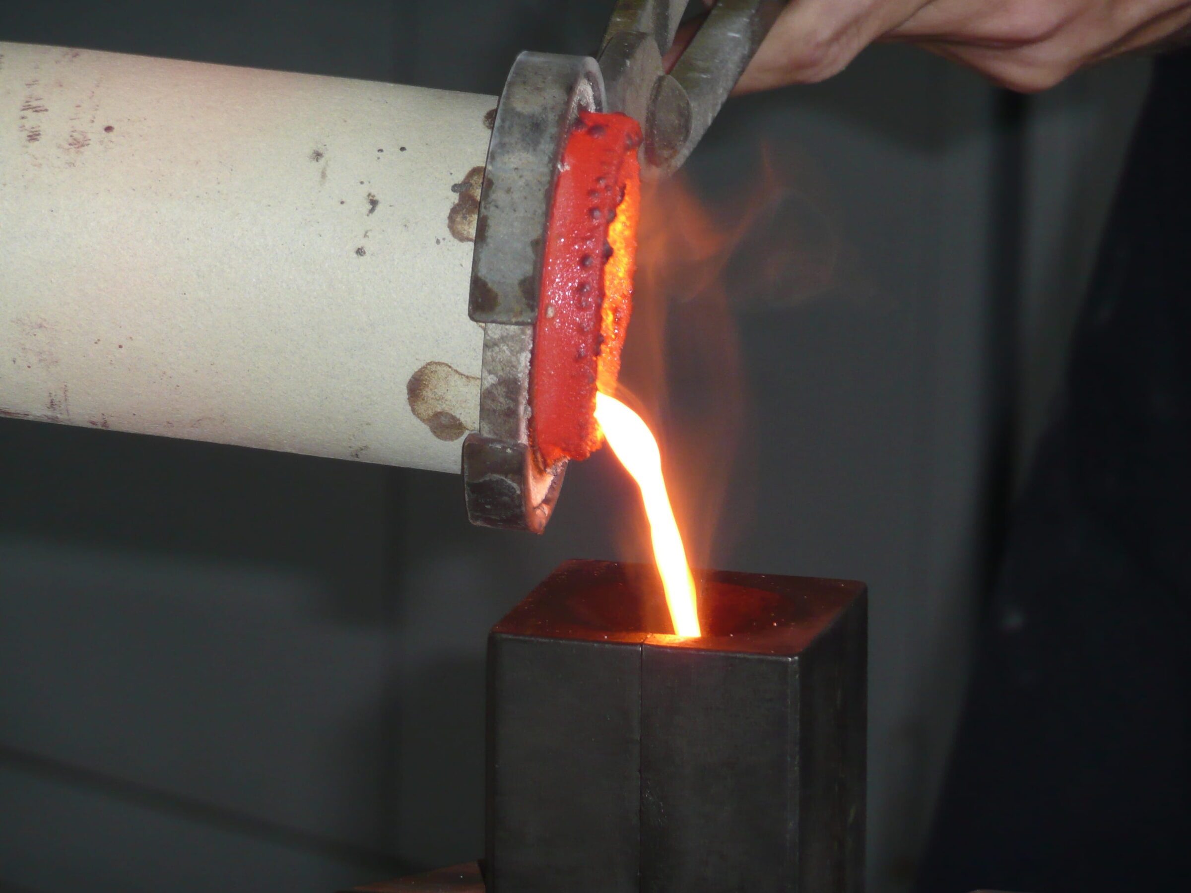 Molten metal being poured in the atelier