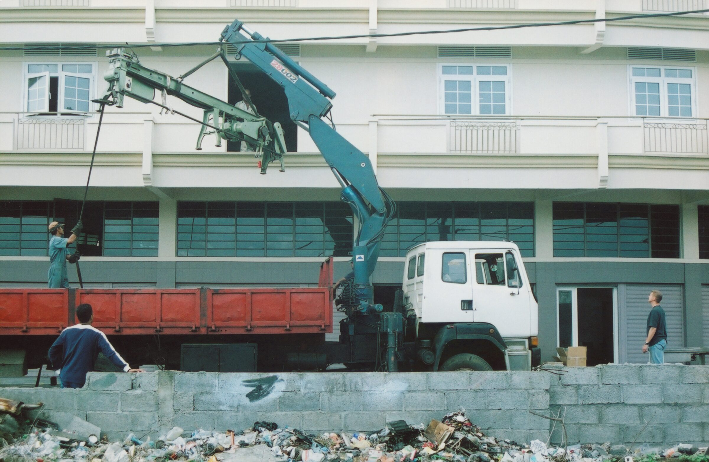 Crane lifting the drawing bench into the building